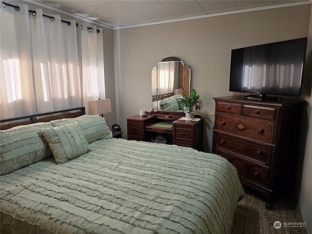 bedroom with crown molding