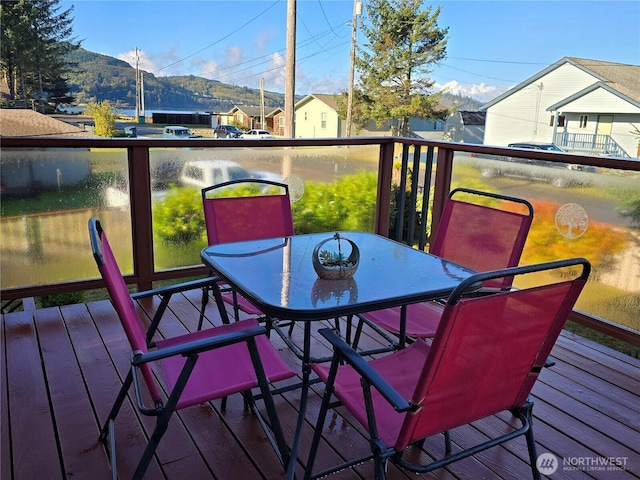 61 Salt Air St, Clallam Bay, WA 98326 - wooden deck featuring outdoor dining space and a mountain view