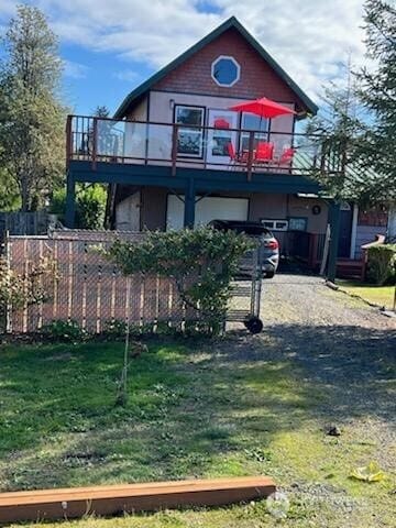61 Salt Air St, Clallam Bay, WA 98326 - back of property featuring a balcony and dirt driveway