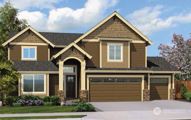 craftsman house featuring a garage and a front yard