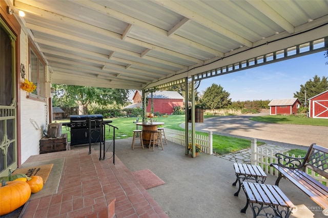 view of patio / terrace featuring a storage unit