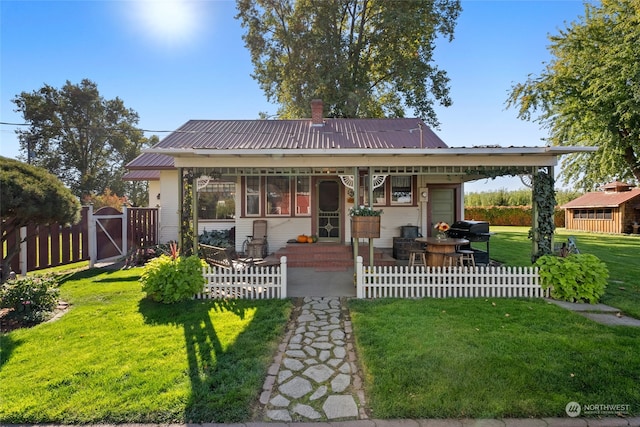 bungalow-style house with a front yard