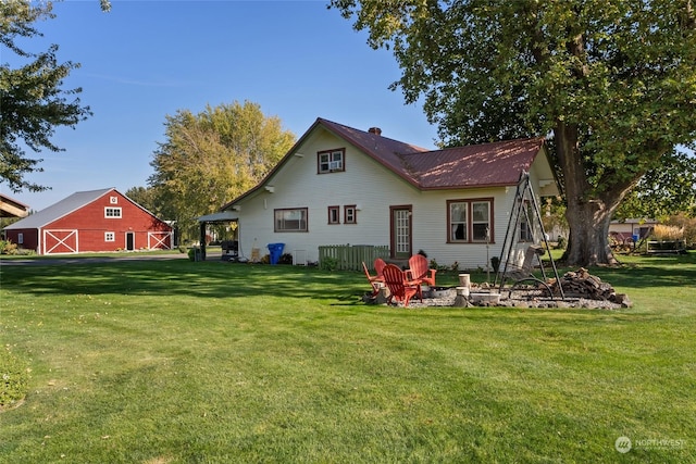84768 Eastside Rd, Milton-Freewater, OR 97862 - rear view of house featuring a barn, a yard, a fire pit, and an outdoor structure