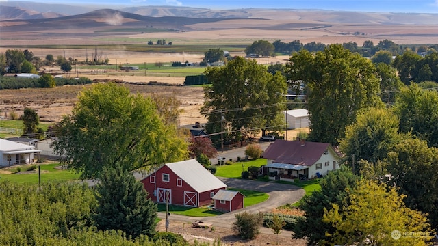 birds eye view of property with a mountain view