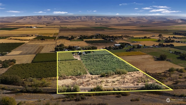 drone / aerial view featuring a rural view and a mountain view