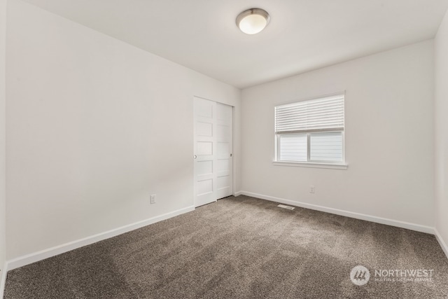 view of carpeted spare room