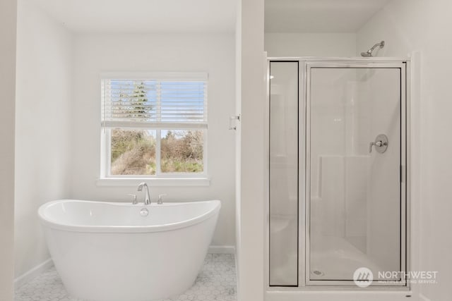 bathroom featuring tile patterned flooring and separate shower and tub