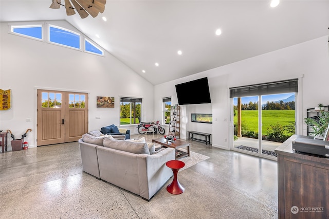 living room with a wealth of natural light and high vaulted ceiling