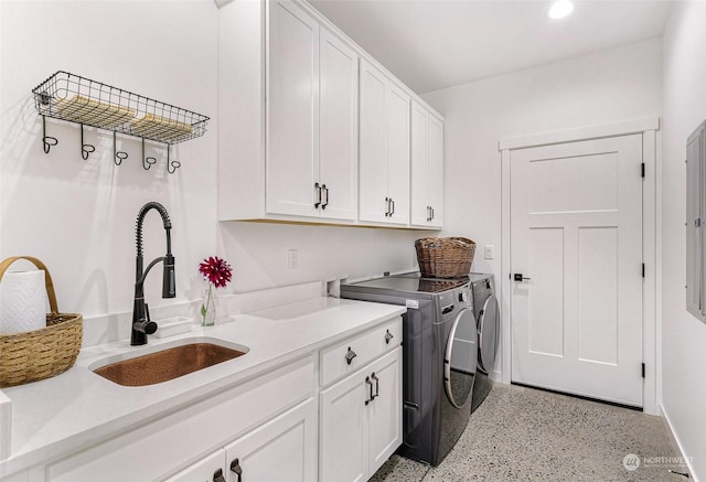 laundry room with a sink, recessed lighting, cabinet space, and washer and dryer