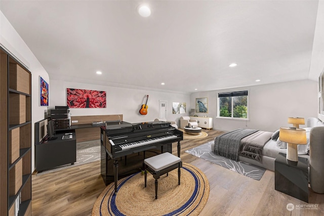 bedroom featuring recessed lighting and wood finished floors