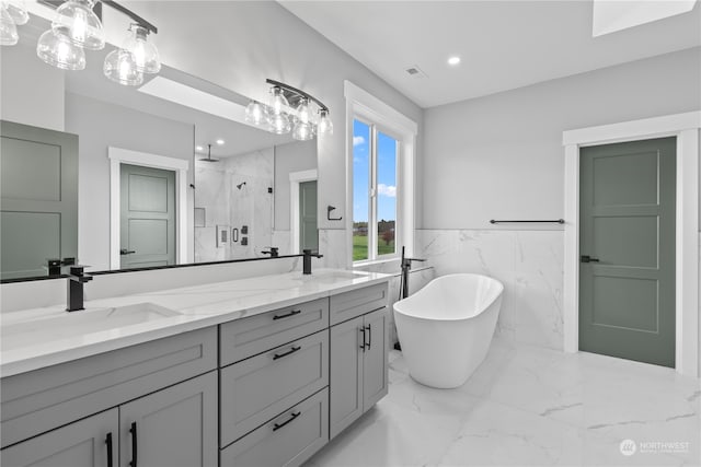 bathroom with vanity, plus walk in shower, and tile walls