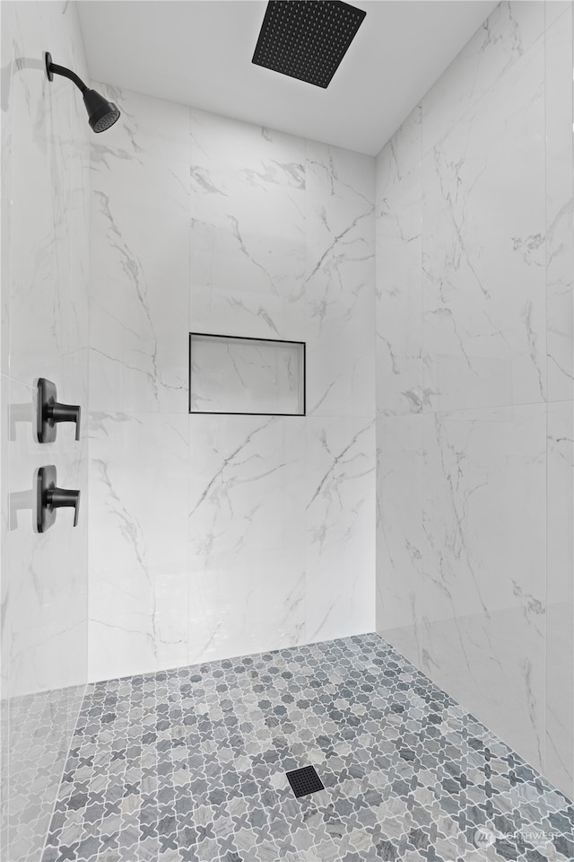 bathroom with tiled shower