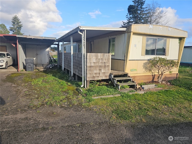 exterior space featuring a carport