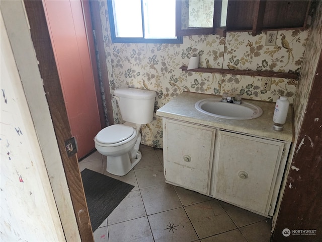 bathroom featuring vanity, toilet, and tile patterned floors