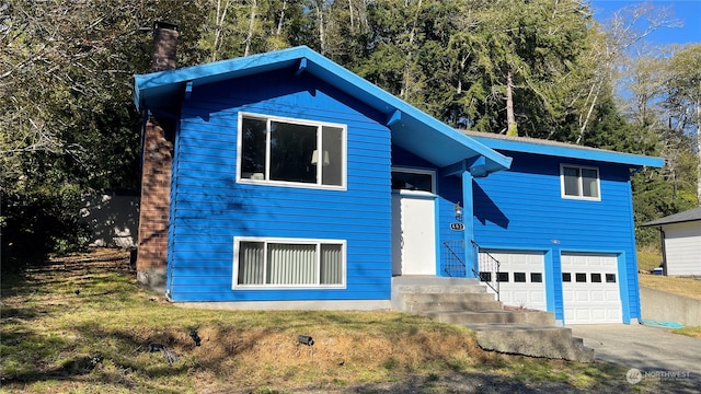 view of front of home with a garage