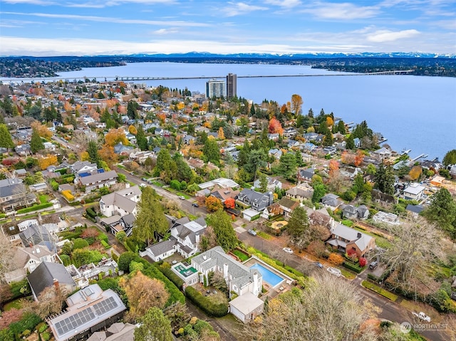 birds eye view of property with a water view