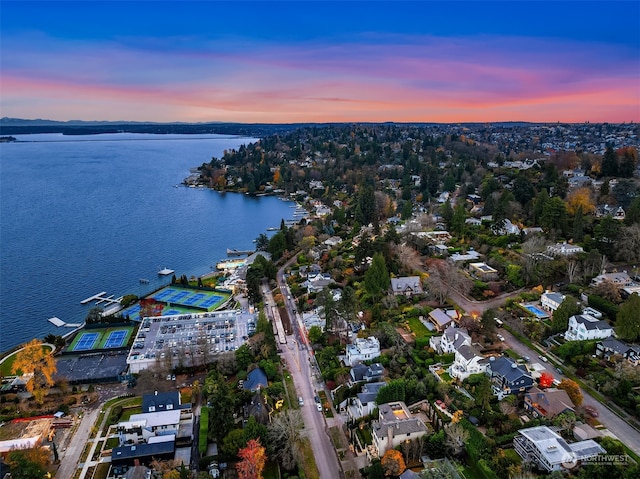 aerial view at dusk with a water view