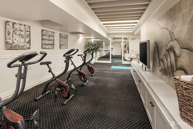 workout room with dark carpet