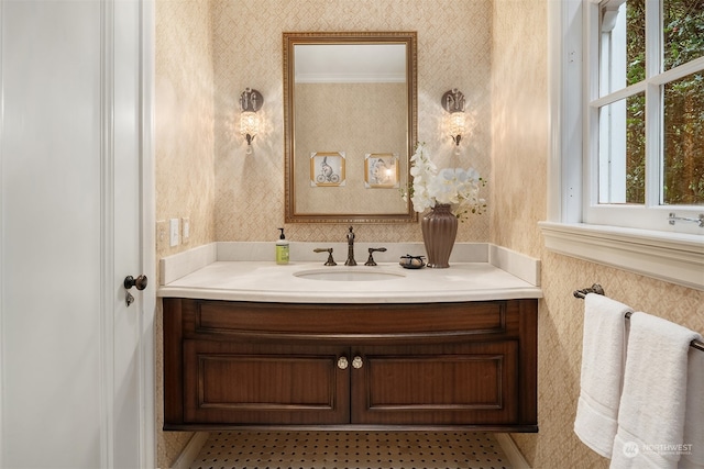 bathroom featuring vanity and ornamental molding