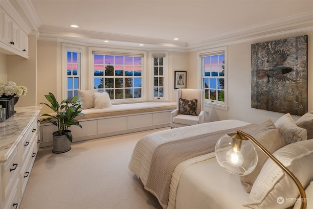 carpeted bedroom with ornamental molding