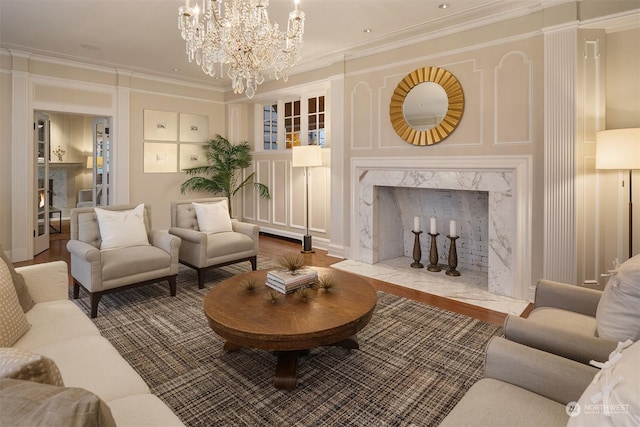 1107 39th Ave E, Seattle, WA 98112 - living room featuring a high end fireplace, wood finished floors, crown molding, and a chandelier