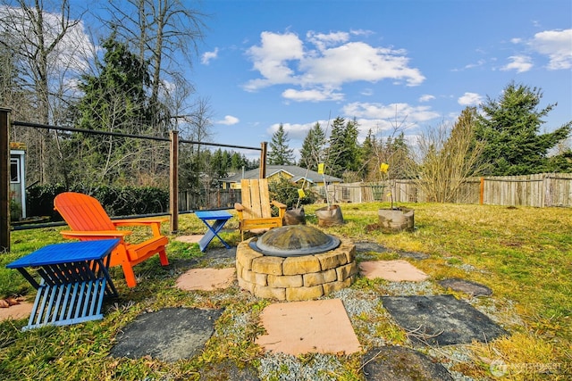 view of yard with an outdoor fire pit