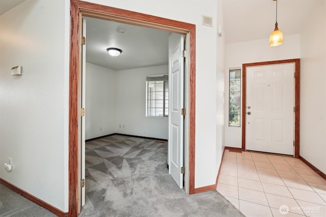 entryway featuring light carpet