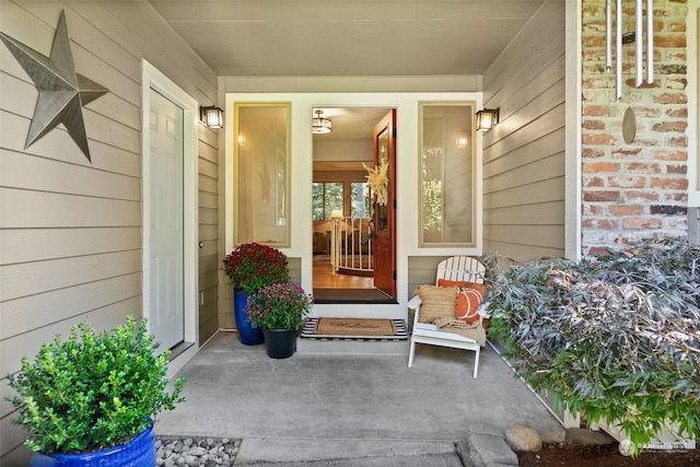 view of exterior entry featuring a porch