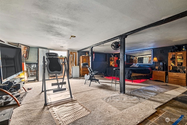 workout area featuring carpet floors, a textured ceiling, and water heater