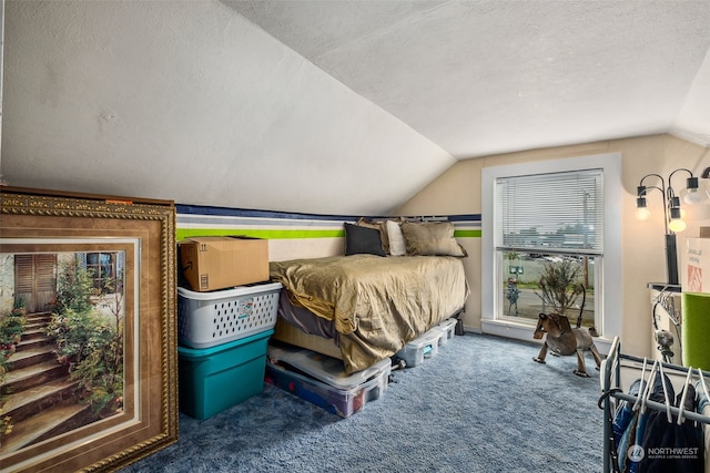 carpeted bedroom featuring multiple windows, a textured ceiling, and lofted ceiling