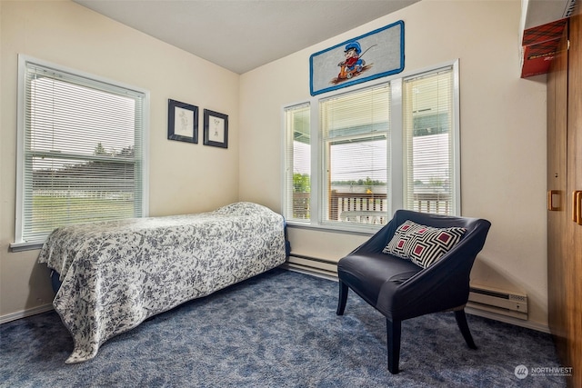 carpeted bedroom with a baseboard heating unit