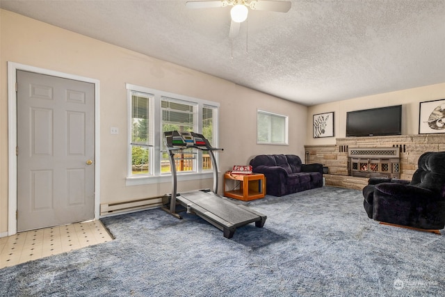 workout room featuring ceiling fan, a baseboard radiator, and a textured ceiling