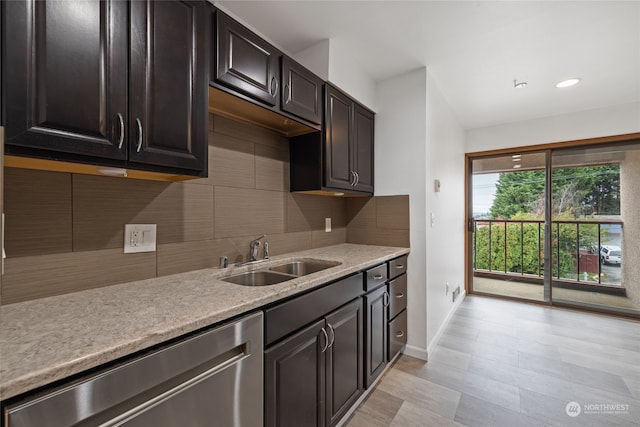 kitchen featuring dark brown cabinets, dishwasher, sink, and decorative backsplash