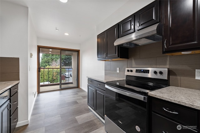 kitchen with stainless steel range with electric stovetop and decorative backsplash