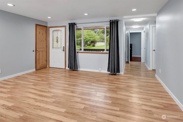 unfurnished room featuring light hardwood / wood-style flooring