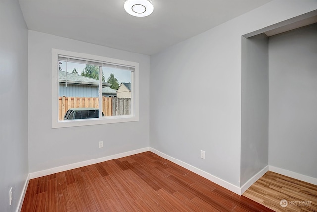 unfurnished room featuring wood-type flooring