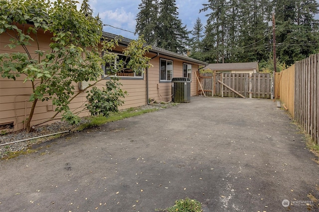 view of side of property with central AC