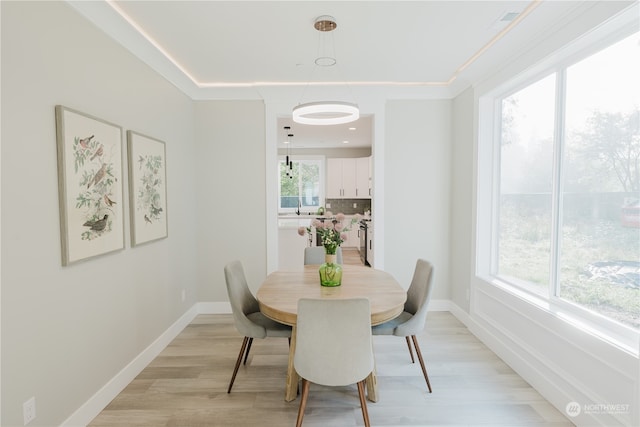 dining space with light wood-type flooring