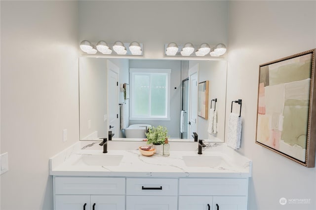 11412 8th Ave S, Burien, WA 98168 - full bath featuring a freestanding tub, double vanity, and a sink