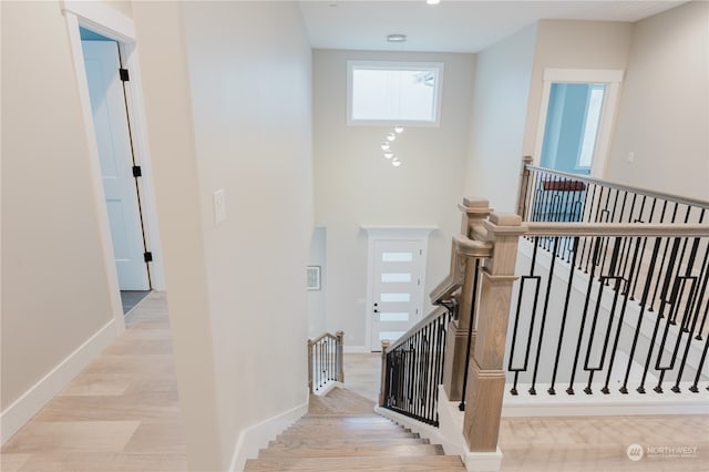 staircase featuring hardwood / wood-style flooring