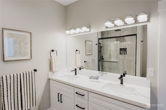 bathroom with vanity and an enclosed shower