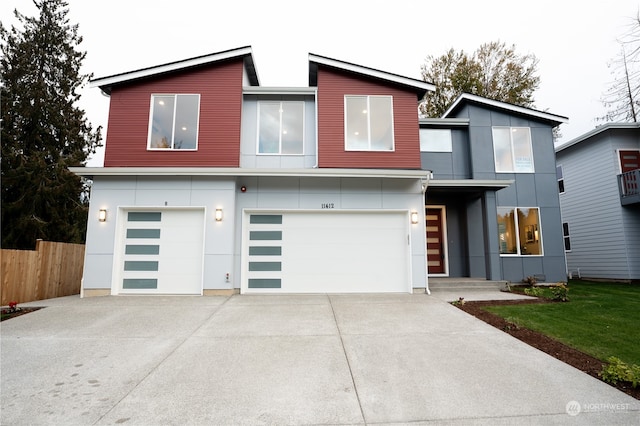 modern home with a front yard and a garage