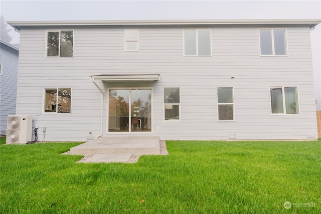 rear view of property featuring a patio area, central AC unit, and a lawn