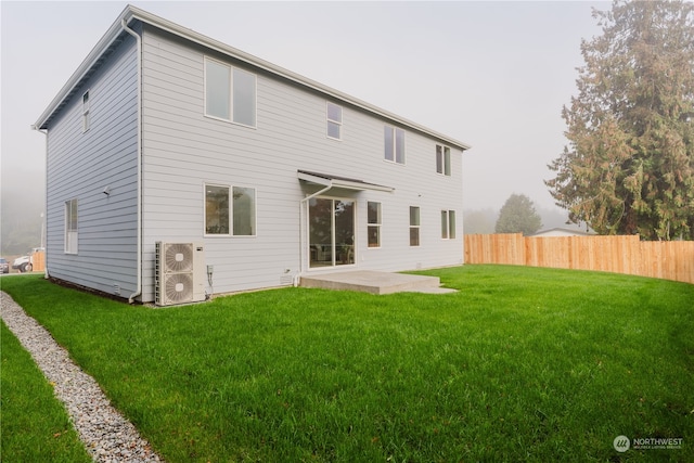 back of property featuring a patio and a yard