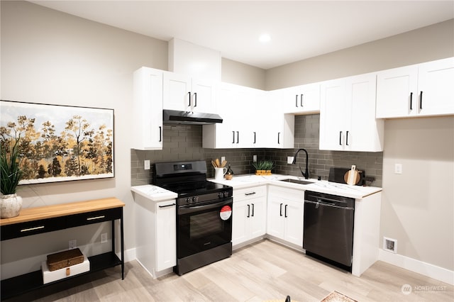 kitchen with white cabinetry, light hardwood / wood-style flooring, black appliances, and sink