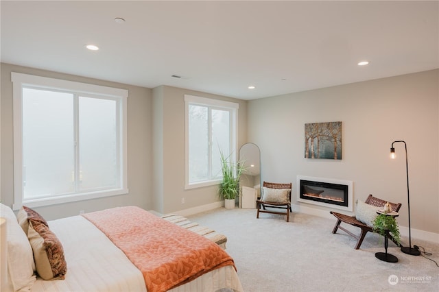 11412 8th Ave S, Burien, WA 98168 - carpeted bedroom with baseboards, a glass covered fireplace, and recessed lighting