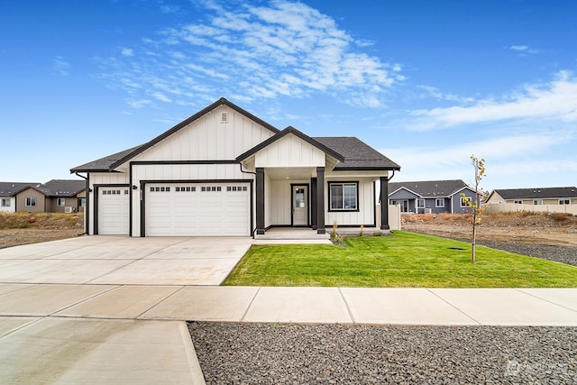 view of front of house with a front yard and a garage