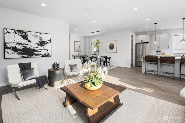 living room with light hardwood / wood-style flooring