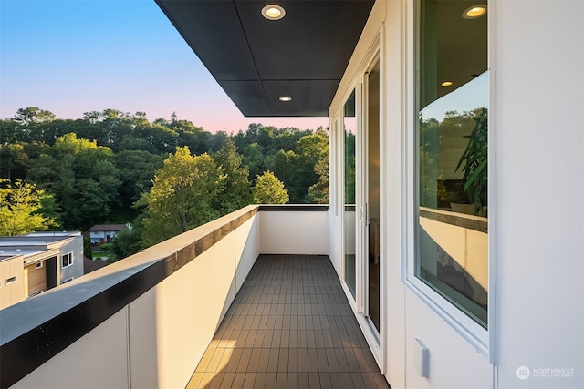 view of balcony at dusk