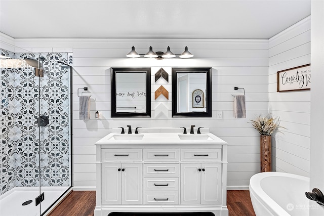 bathroom featuring vanity, wooden walls, separate shower and tub, and hardwood / wood-style floors